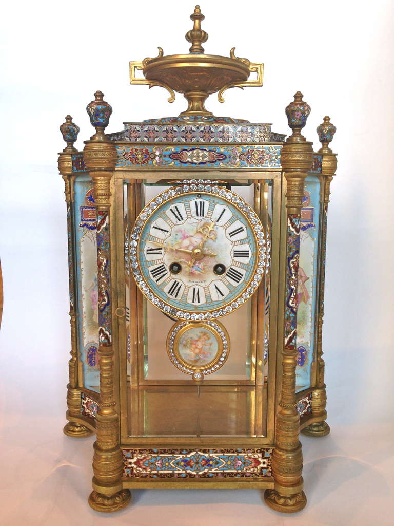 A wonderful assembled Champleve enameled clock set, the colorations are 
matching so very well and the style and periods are identical, even the gilt bronzes are Patinated similarly. We are offering the urns and the separately 
Or you can by the