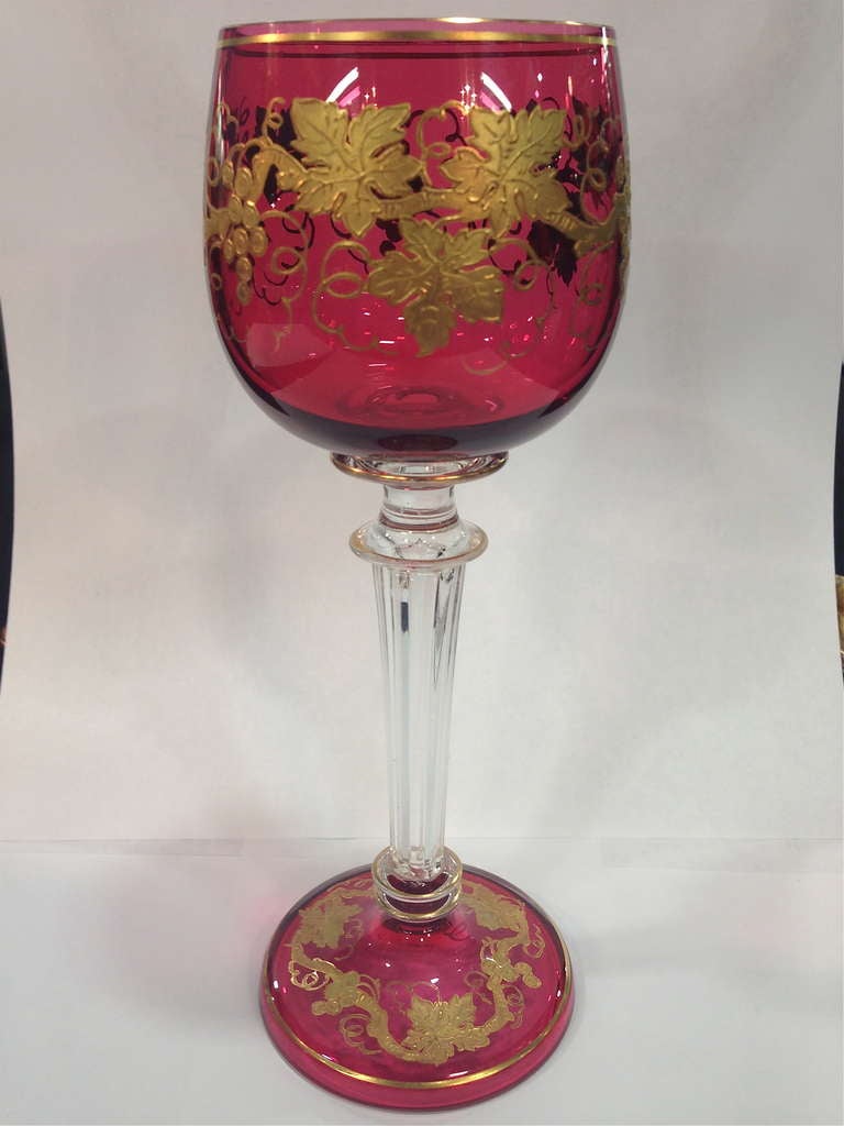 Made in France around the turn of the century these are very unusual even the stem is fluted and the two colors separated by the clear stem really pops and then the raised paste gilding in a grape and vine motif is very fine. As found in fantastic