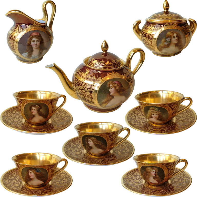 This is it the worlds most beautiful tea set in Vienna style with portraits and the
most incredible raised paste gilding, and to top it off the root beer color of the 
iridescent glaze is one of the most desirable. The shapes of the pot, cream,