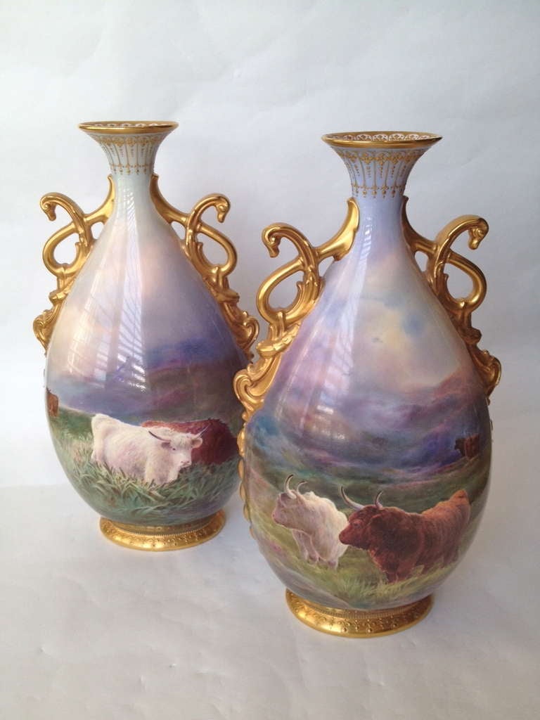 Royal Daulton recognized as one of the finest firms producing porcelain in England even to this day. The pair of vases offered are by J. Hancock he was
Responsible for painting many of the lovely landscape scenes such as this the cattle are so well