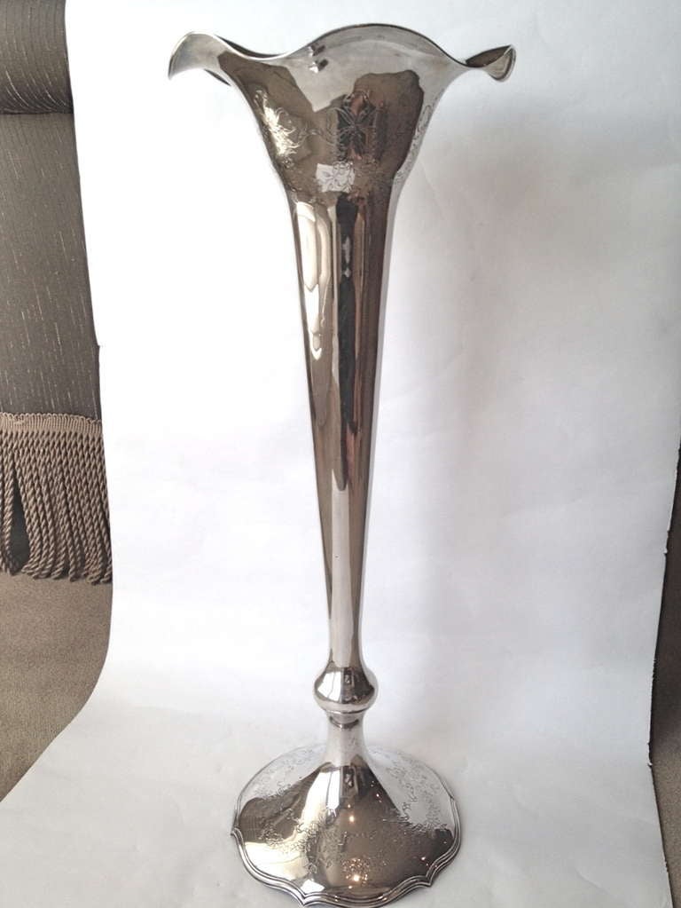 A very large and imposing sterling silver vase by Shreve and Co. We know this because of the form and construction, often pieces were commissioned by other retailers and the actual maker would defer by not signing. The chased
Decoration is fine and