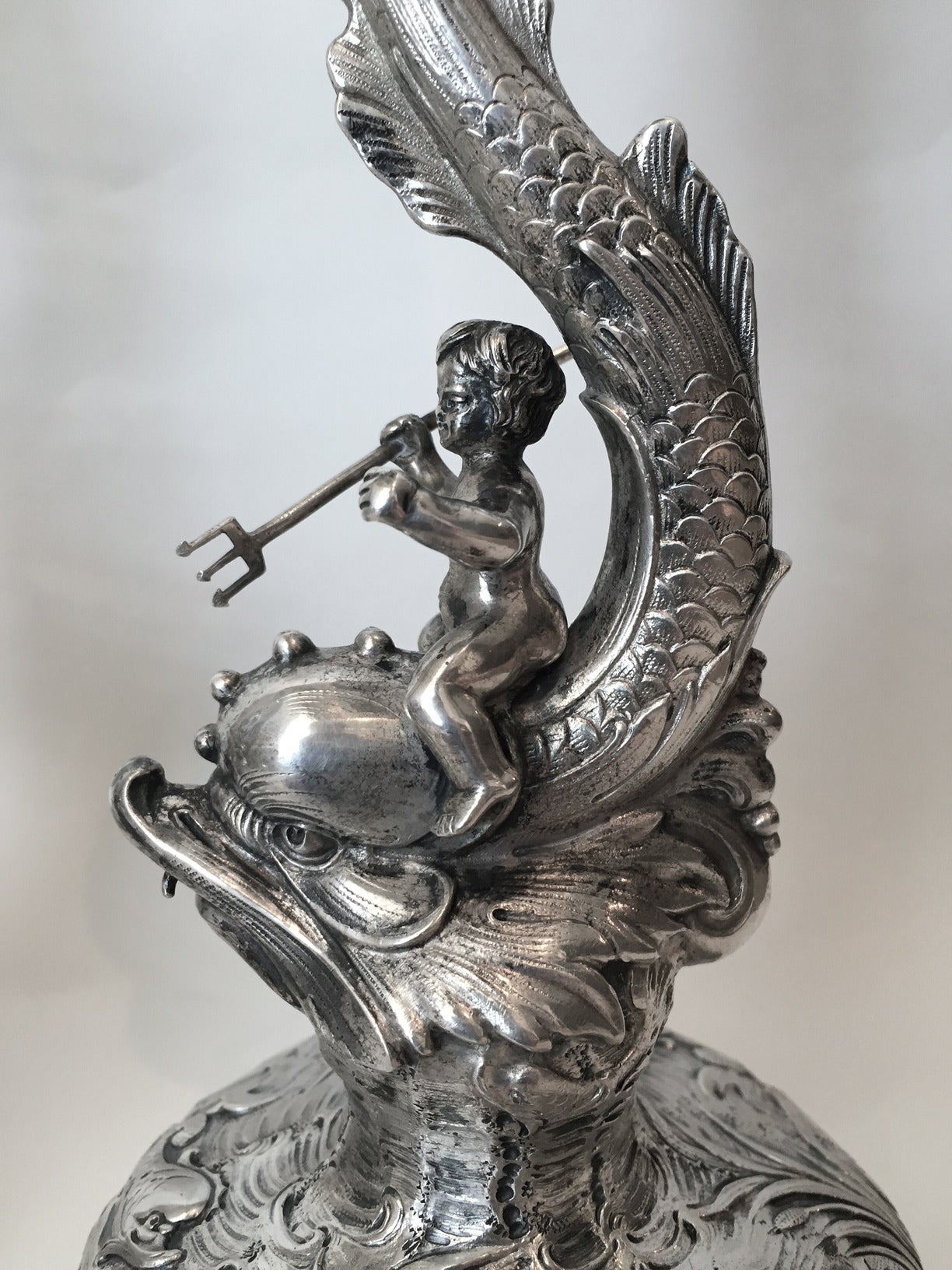 German Impossible Set of Eight Putti Driven Dolphin Form Candlesticks, circa 1900