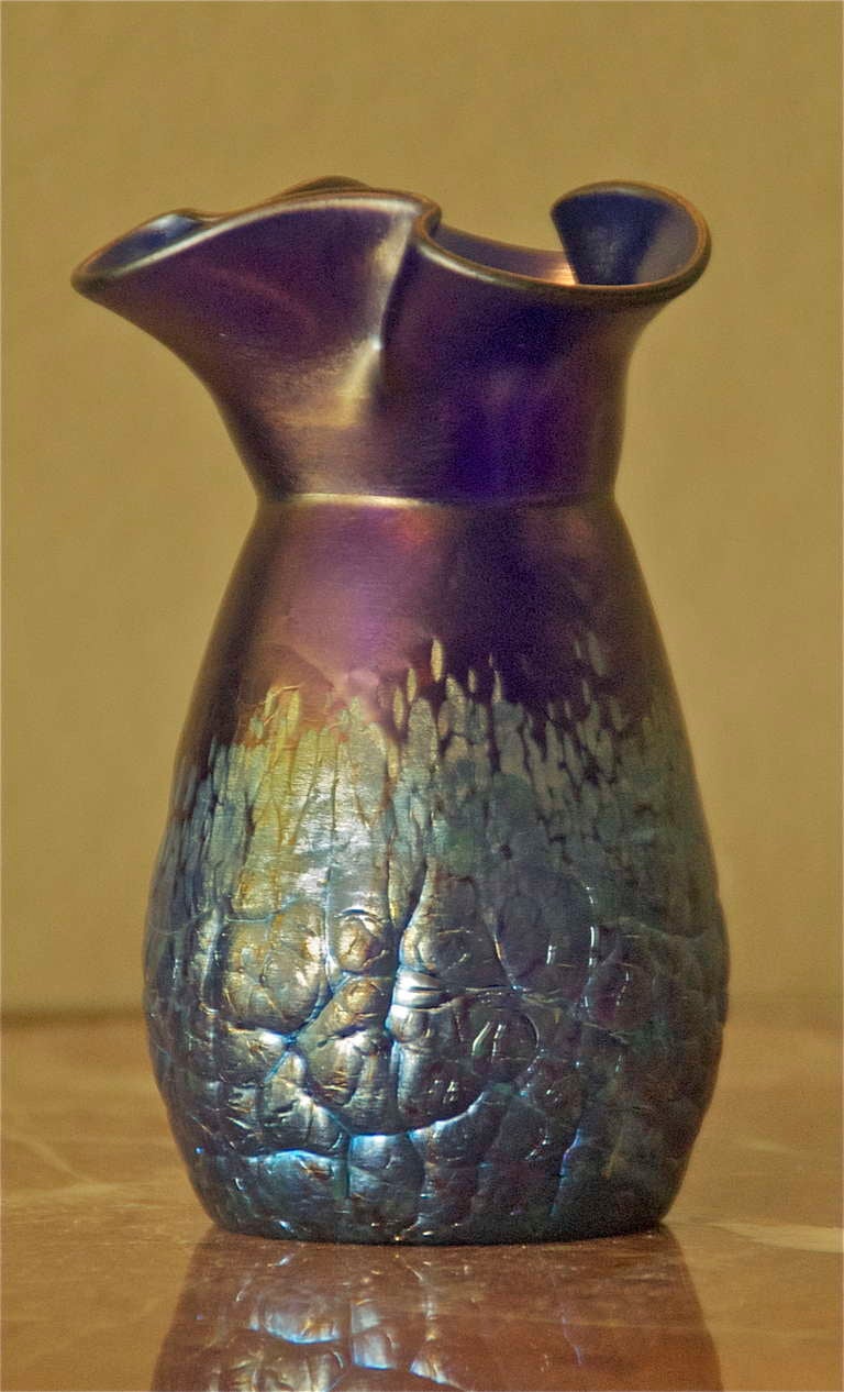 This Very Rare Loetz Lava Art Glass Vase Using the iridescent glaze at the bottom and leaving the top without is an exemplary display of control. This piece came from a major Loetz glass collection in the southern California area. Many pieces