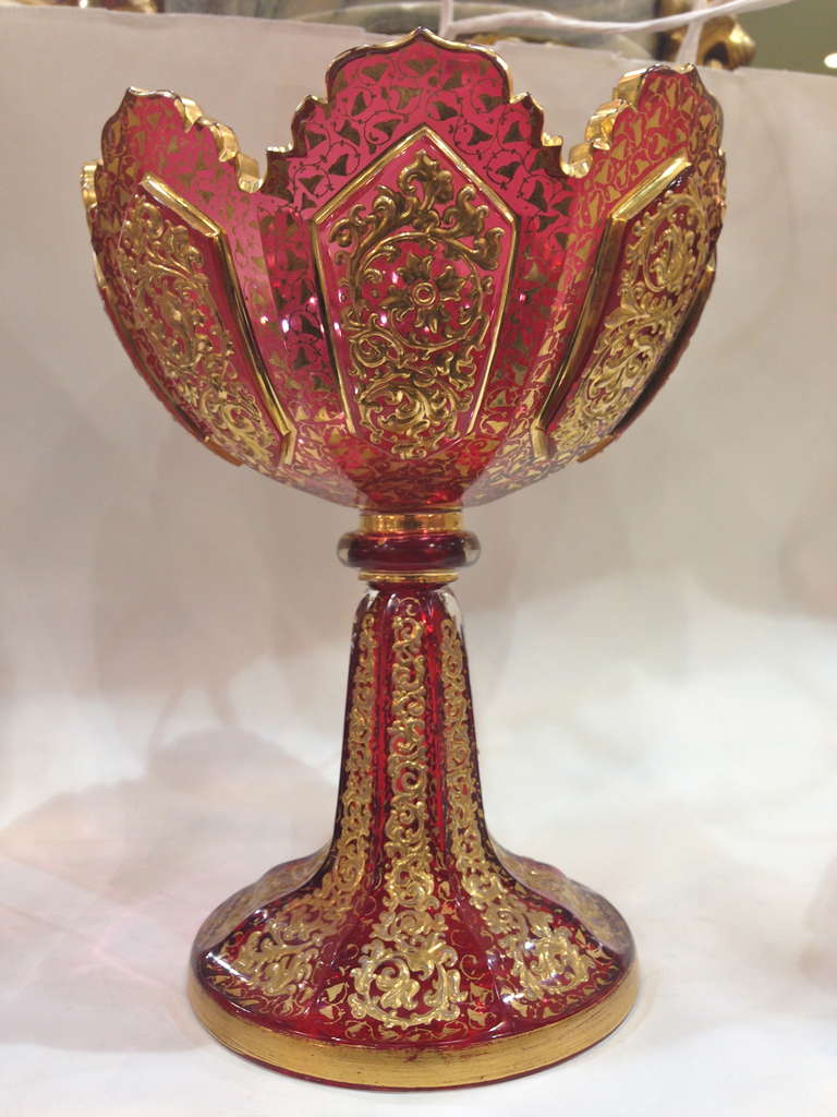 A fabulous moser compote, with over the top raised gilt decoration, the deep Cranberry glass color the perfect ground
Against the gold, finishing at the top with
the beautiful cut. Condition is excellent.