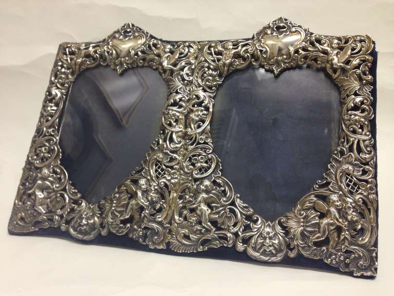 A wonderful sterling double heart frame.