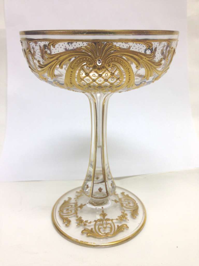 Service for ten of the most beautiful heavily raised gilt stemware we have ever had for offer. The very rich and classic design is expertly rendered with diapering centering inside a cartouche surrounded by raised paste highlights
In the form of
