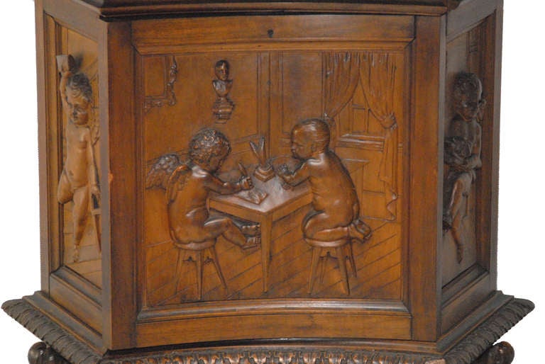 Important Renaissance Revival Desk by Valentino P. Besarel carved with full figure cherubs, panels carved in relief. Putti in various pursuits related to writing and delivering what most certainly would have been Love Letters. The side drawers slide