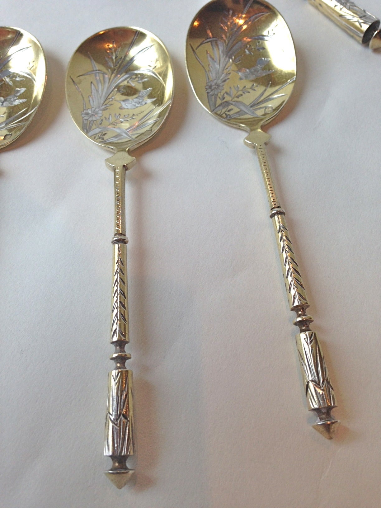 Beautifully executed cast and chased to perfection is this set, the circle shape ice cream cutter, and the little sauce spoon, even a nut spoon. Charming with the bird chased on each piece. The condition is exceptional. Hallmarked for French