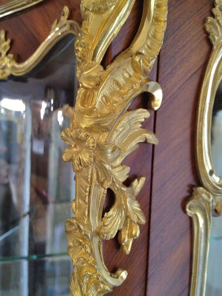 Extremely fine and important vitrine by Boudet 43 Blvd des Capucines Paris. Mounted in gilt bronze, with the lower section 
centered by a beautiful Verni Martin Cartouche expertly painted with a love scene. The sides are decorated with Fine