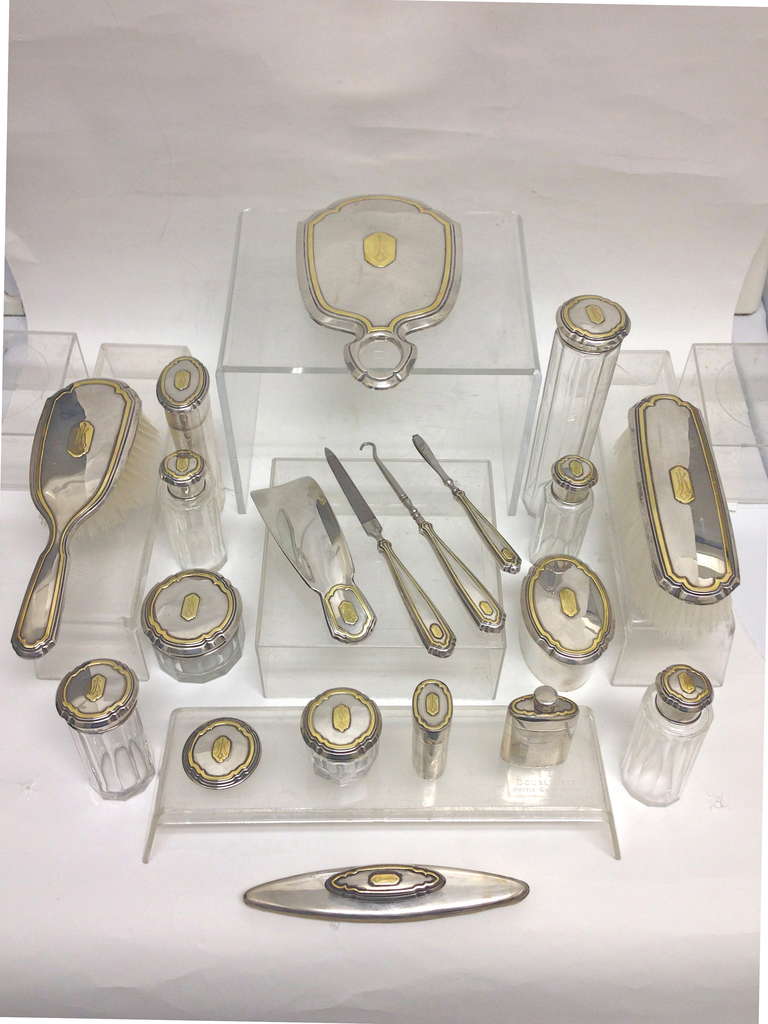 This set is exceptional, so complete and very deluxe with the applied 14-karat gold 
design work. The use of gold on this sterling silver set was a statement that the
owner has achieved a position in the upper echelon of society. We know who the