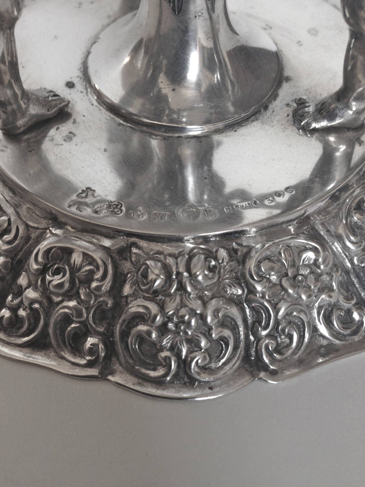 This rare set of four German .800 silver and crystal candlesticks are very well cast with chubby cherubs with faces that have character, playing ring around the rosie. In fantastic condition. Fully marked as pictured.
