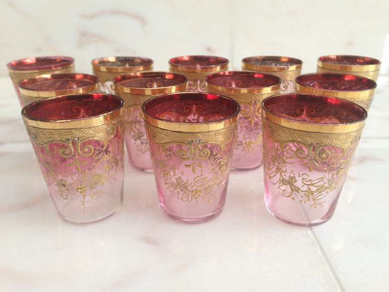 Twelve Rare Moser Shot Glasses, Cranberry to Clear Raised Gold Gilt, circa 1900