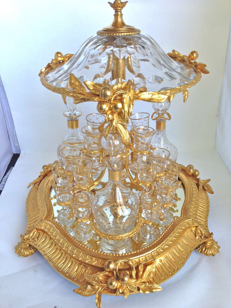 We have never before had the pleasure of even seeing this model,
and we have seen a lot of examples in our career. First off the piece
Is wonderful quality, the castings are fine, the crystal cut, with gilt decoration on the stemware and bottles.