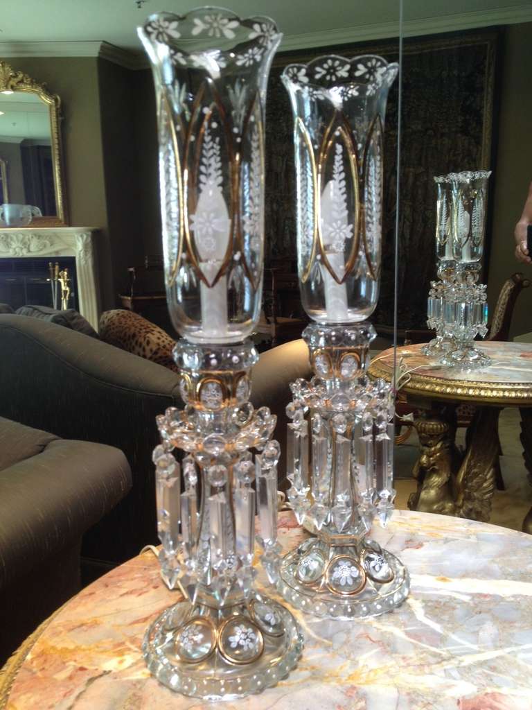 This is a lovely pair in CLEAR glass picture is problimatic! See detail shots. In immaculate condition the glass with gilt highlights and enamel decoration finely painted, hung with prism spears to further draw attention by reflecting light.  The