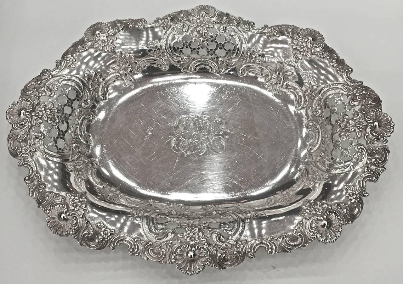 A lovely pair of Tiffany and Co.
sterling silver garniture bowls.
The open work or reticulation 
with diapering decoration, also
applied edges showing off the
silversmiths skills, chased with
flowers. Tiffany is recognized as 
one of the