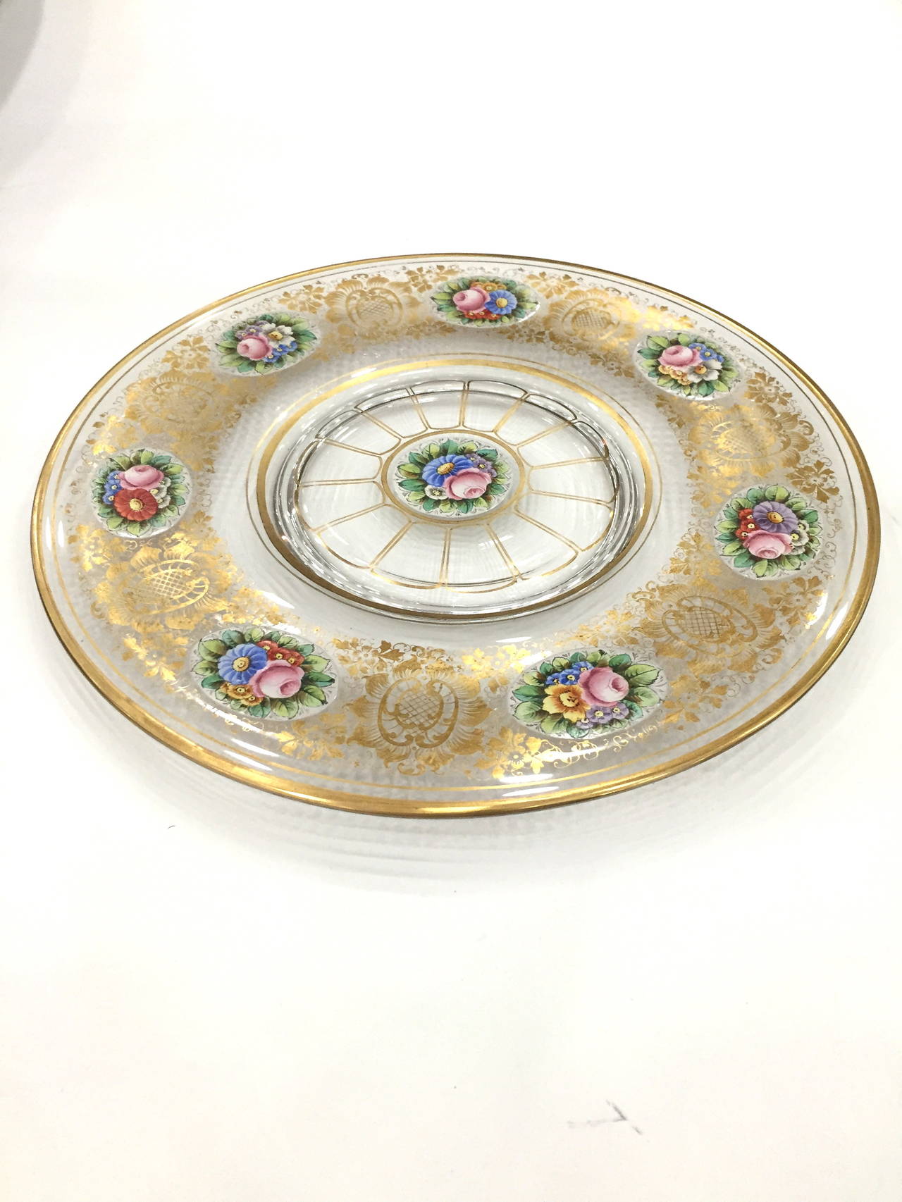 Over the top set of 12 service.
Plates by Moser with gilt highlights and seven hand painted Floral cartouches and
and center. Exceptional condition. Perfect for display and will serve you well at the table.