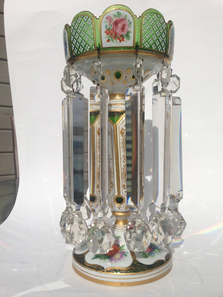 This lovely pair of lusters Hand-painted with flowers and glass overlay white to emerald green color. The prisms are massive and very rare. These are great on the mantle but are not at all limited to that location.