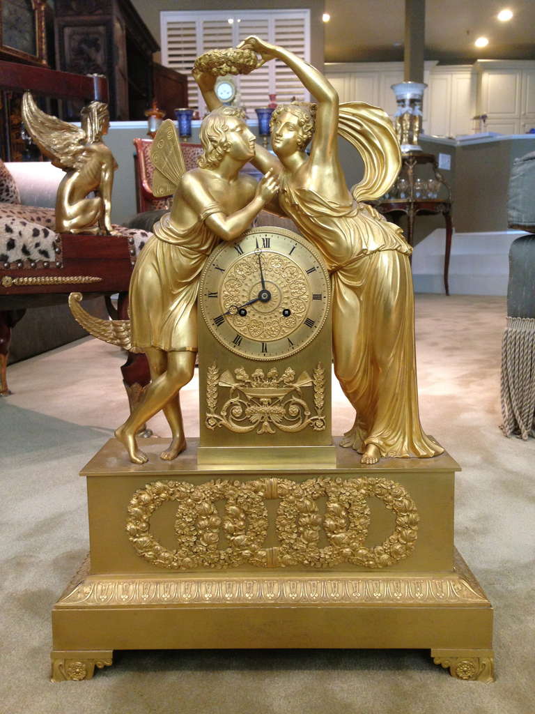 Fantastic quality is found in every aspect of this time piece starting with the color of the gold, and the extremely fine and crisp casting of the bronzes. The subject of Cupid and Psyche is as good as it gets. As you can tell we are proud of this
