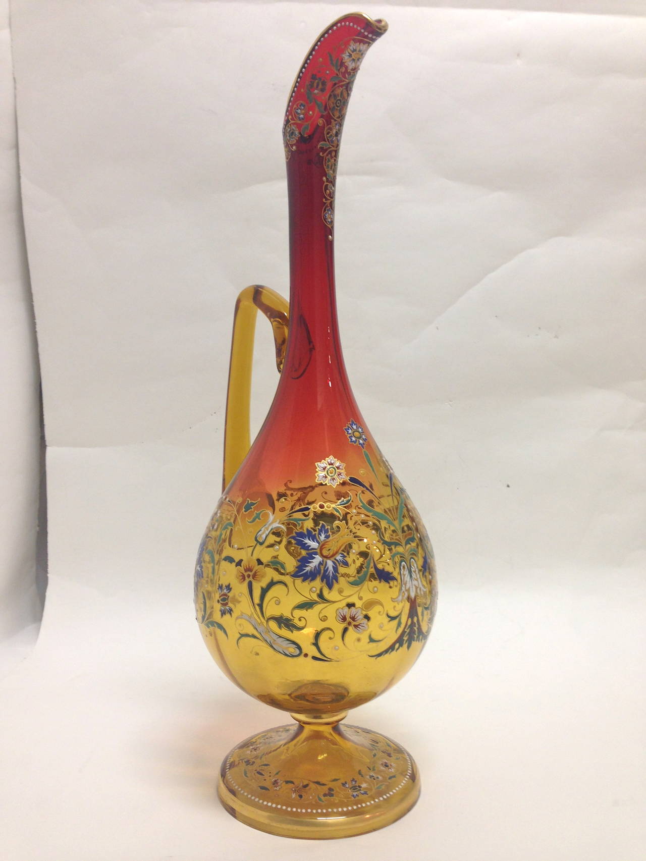 This fantastic Moser amberina exhibition Ewer is not only of large-scale but it is also extremely well executed. The enameling is expertly painted and gilded the design showing restraint but very strong, love the work at the spout and the color of