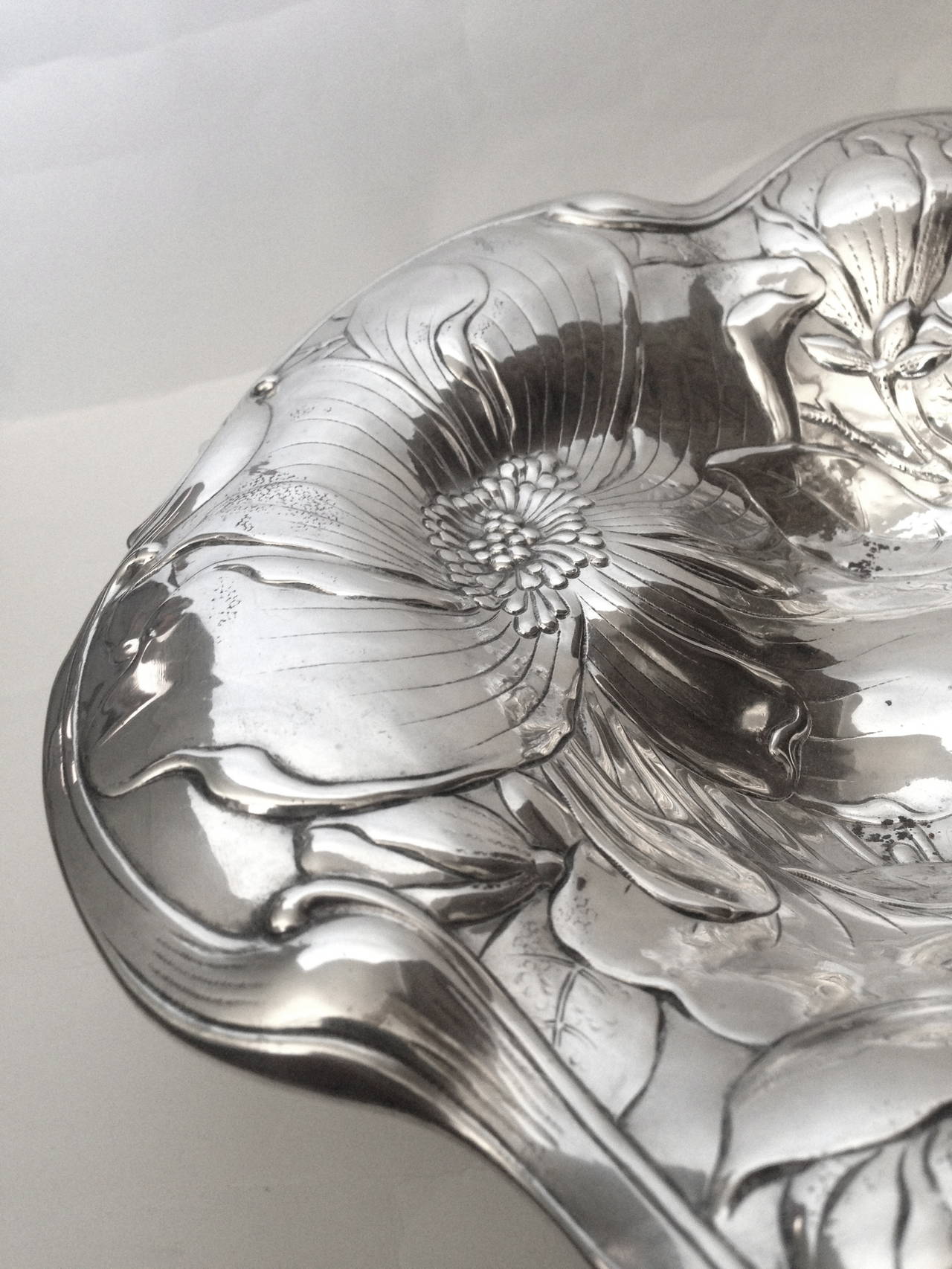 This is over the top, Huge and very finely done with the chrysanthemums 
In low relief beautifully modeled with the edge of the tray undulating. Quite a nice thing and will be exceedingly useful and decorative. Gorham the maker
the condition