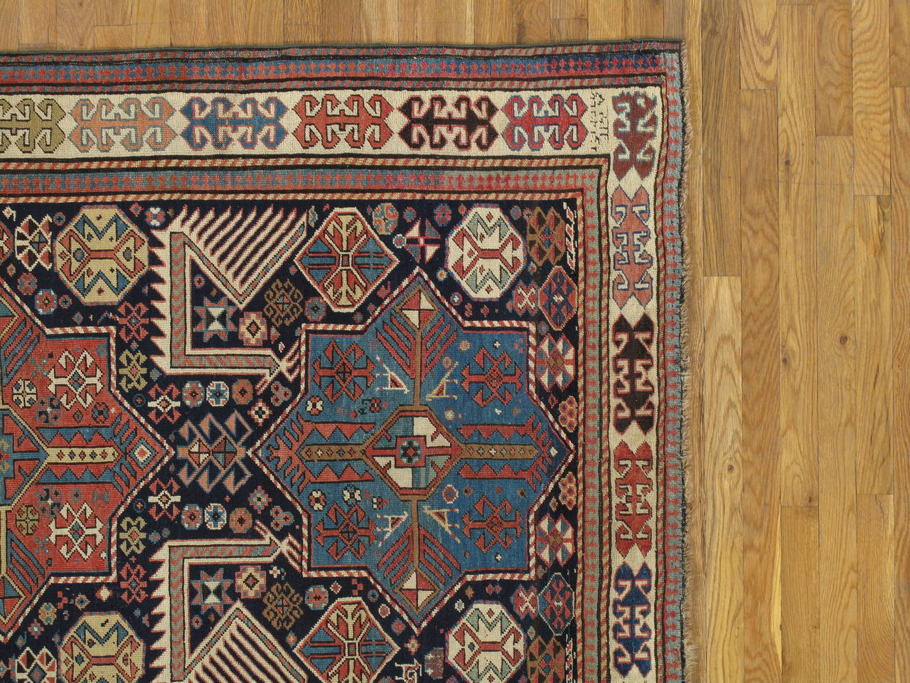 Shirvan rugs are often the most sought after antique rugs from the Caucasus. Shirvan rugs were made not far from those of Kuba, which are closely related in terms of design and coloration. But Shirvans tend to be distinguished by a larger, more