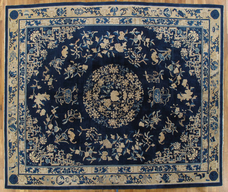 Antique Peking carpets were woven in classical Chinese patterns, with their fret borders, shou medallions, and other far-eastern motifs.  These carpets are bolder and simpler, finer in weave. Lucky bian fu bats and charming bouquets punctuate the