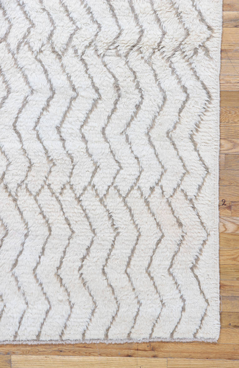 This Hand Woven Moroccan Runner has a deep wool pile using the highest quality of natural ivory wool and bold, geometric brown pattern.<br />
This classical pattern is modern an arranged to fill the elongated field beautifully. These expansive