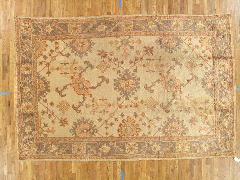 Antique Oushak 6.8 x 10.

West Anatolia is one of the largest weaving regions in Turkey. Since the 15th century, Turkish rugs have always been on top of the list for having fine oriental rugs.
Oushak rugs such as this, are desirable in today’s