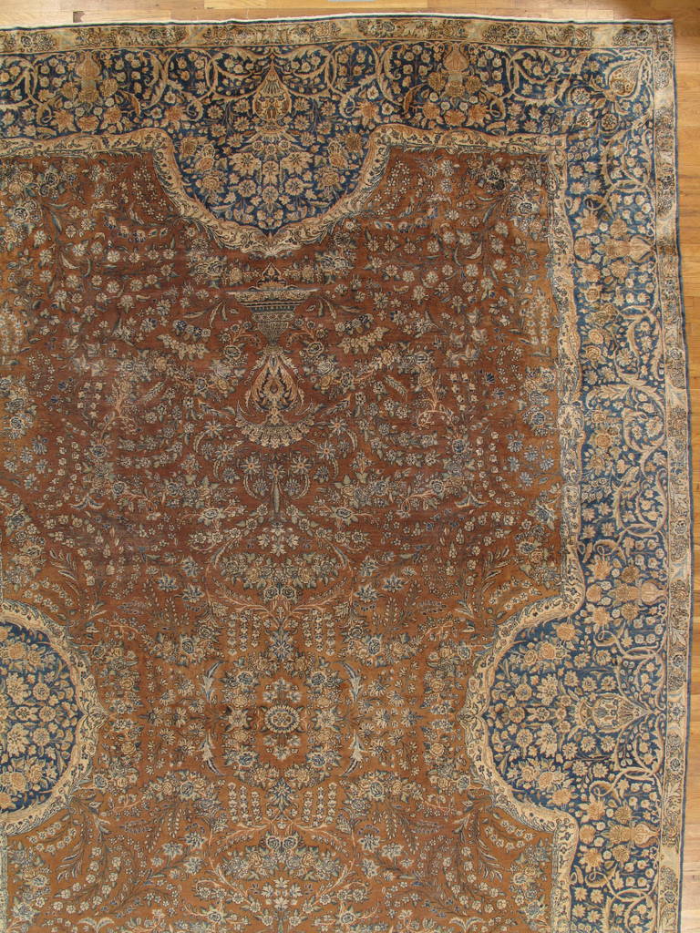 This master crafted Persian Laver Kerman carpet exemplifies the profound understanding of the artistic principles of balance and harmony that make art-level antique rugs so inspiring to live with. Indicative of the best classical Persian carpets of