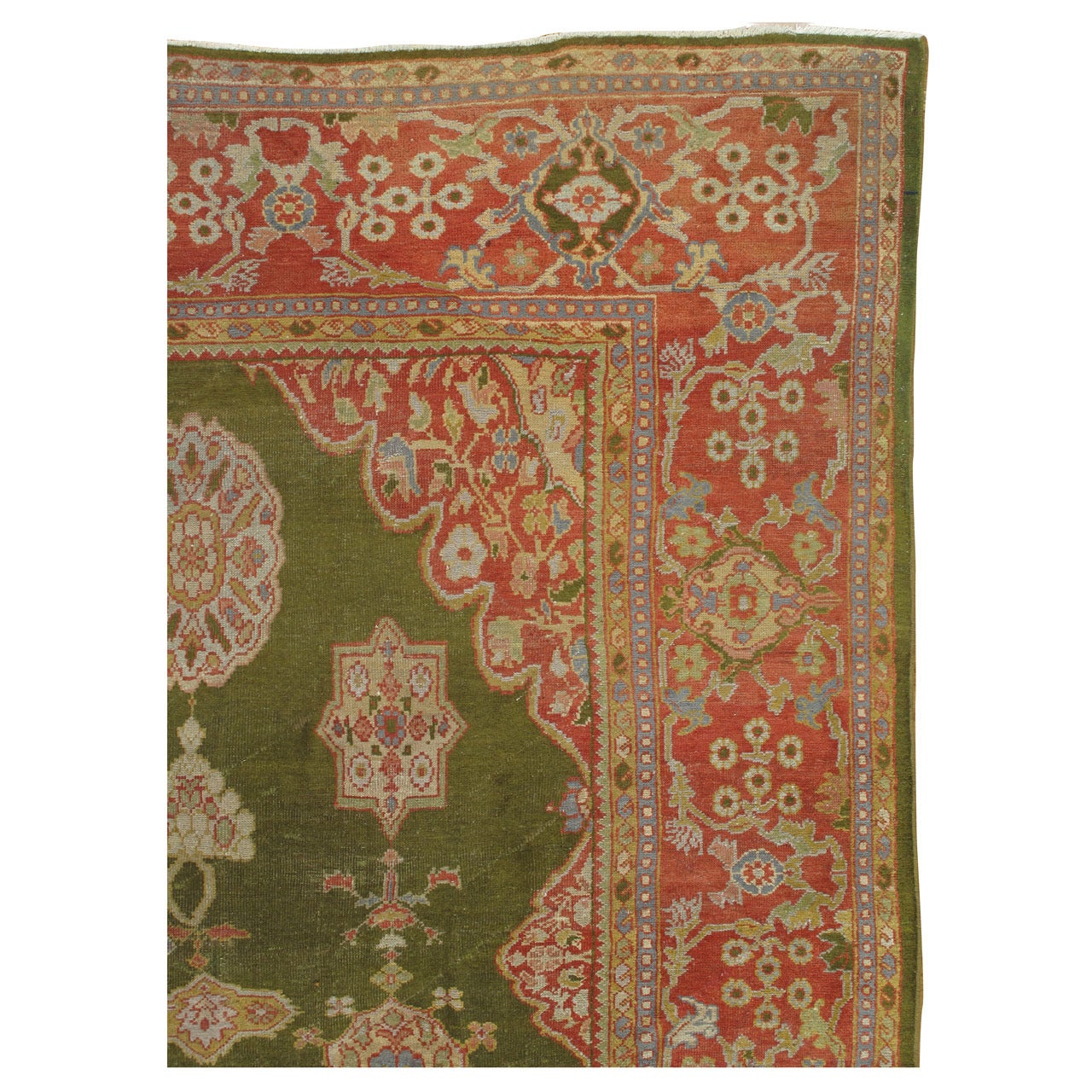 Tapis persan ancien Sultanabad vert, rouge corail, bleu clair, or et ivoire
