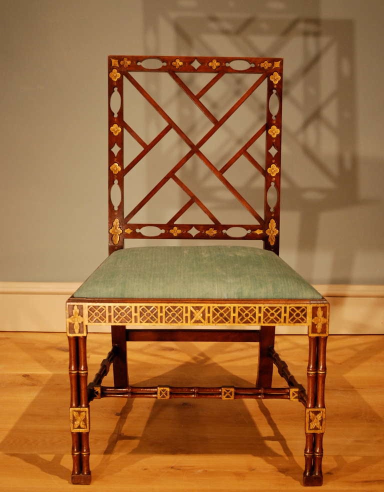 A rare parcel gilt mahogany side chair, having parcel gilt relief decoration to the fretted back, seat frame, cluster column simulated bamboo legs and stretchers. This chair is in remarkable condition and retains it's original surface and gilt