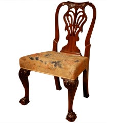 A carved mahogany cabriole leg side chair.