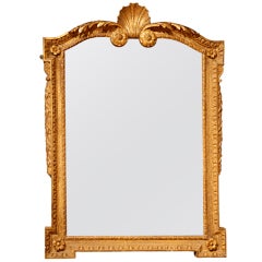 An 18th Century carved giltwood mirror.