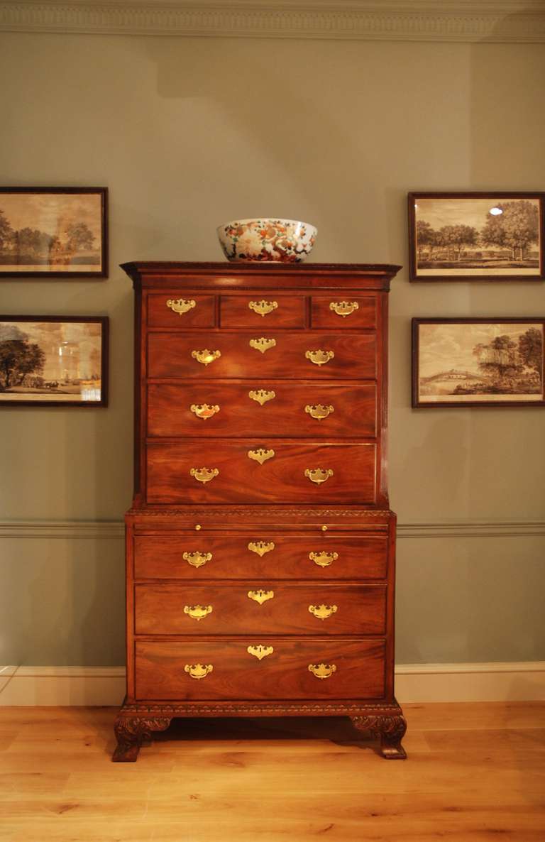 A good 18th Century mahogany tallboy in two sections. The drawers and brushing slide retaining their original brasses, the mouldings finely carved as are the feet with strong Rococo inspiration. Circa 1750.