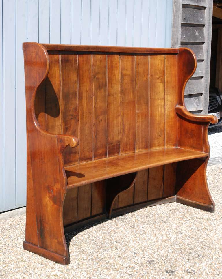 Rustic A late 18th century fruitwood settle. For Sale