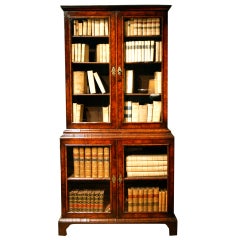 A rare early 18th Century veneered walnut display cabinet/ bookcase