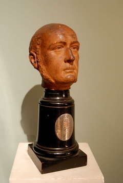 A terracotta bust of Lord Revelstoke dated 1887.