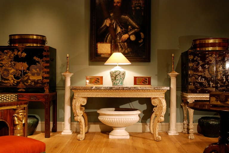 A fine English Palladian marble top table, the rectangular marble top above an egg and dart Vitruvian scroll carved frieze on double C scroll acanthus, paterae and carved scaly legs, the reverse carved with trailing bell flowers on scroll feet.