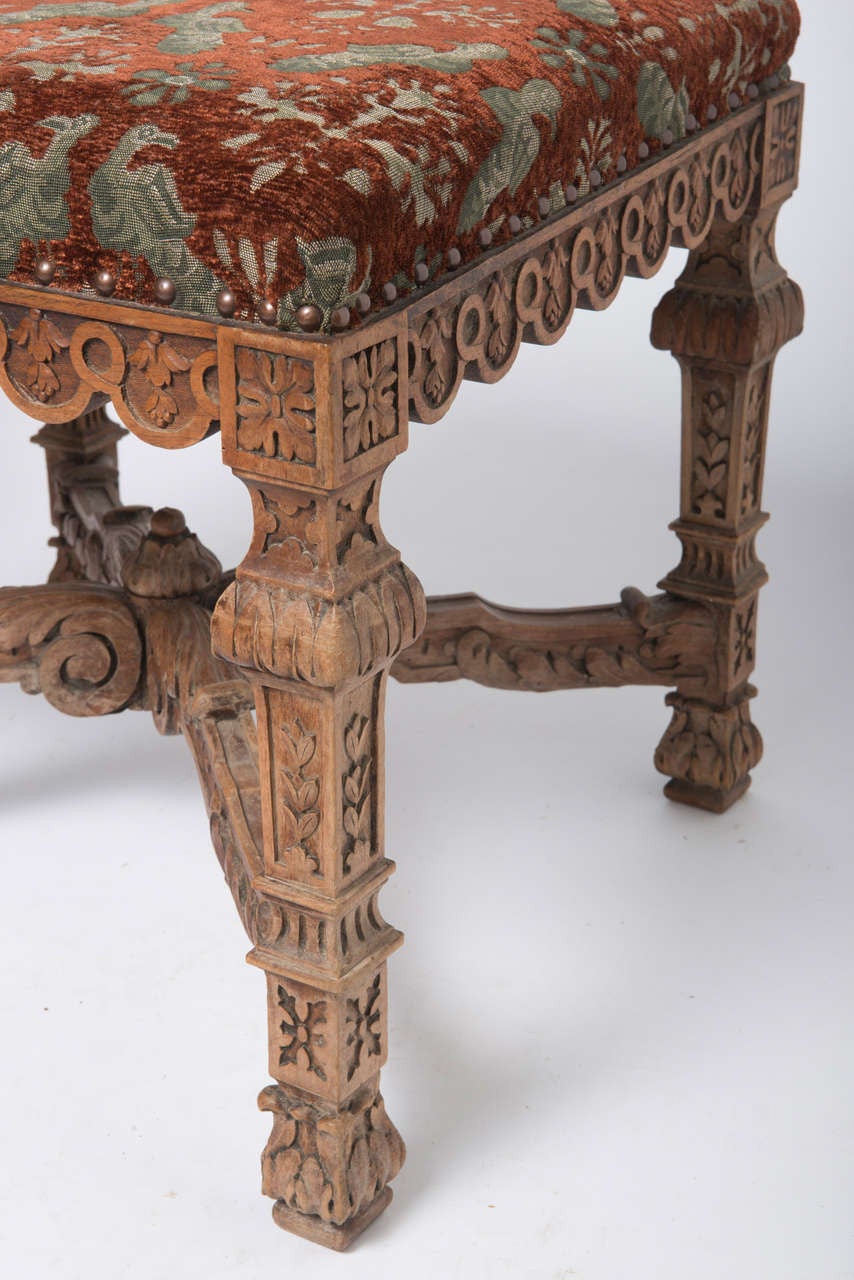 Pair of well carved and upholstered stools