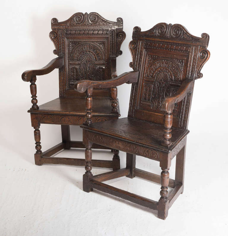 Pair or chairs with carved arcaded backs.