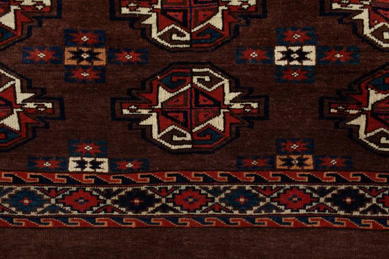 Antique Turkmen Yomut bag face circa 1880 - very good condition, in rust, cream and Navy blue. Handmade antique collectable Turkoman Yomut rug in deep burgundy colour with classic Yomut Geometric rug design, including symmetric medallions in white