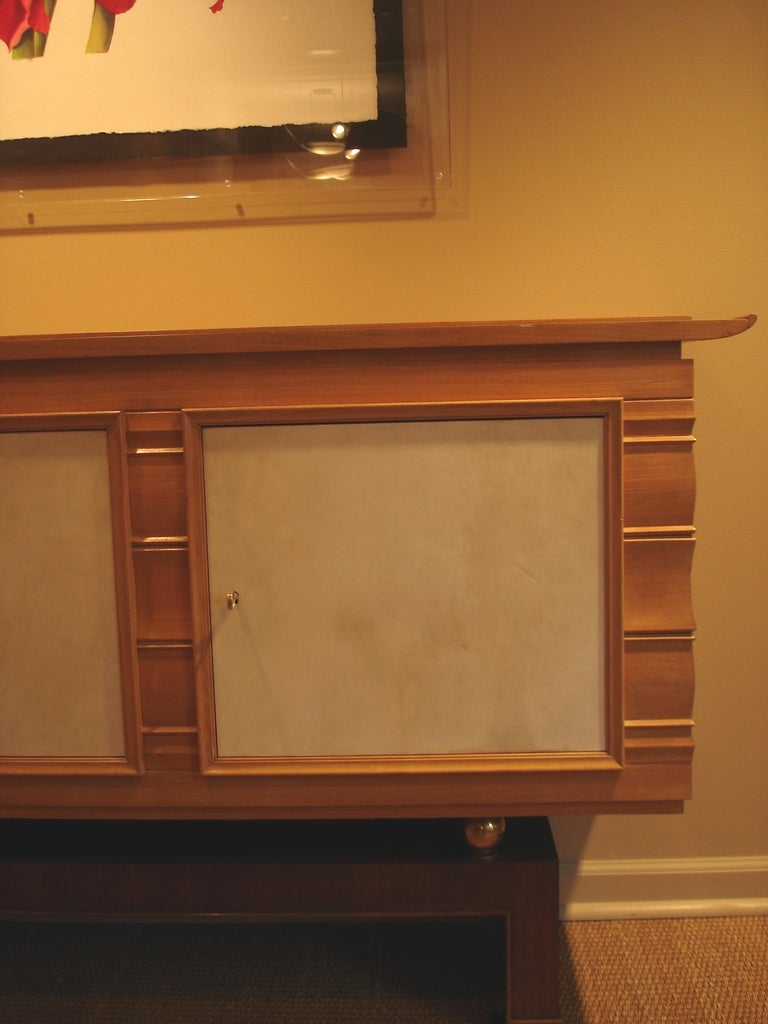 Oak, walnut, brass and parchment sideboard, in the manner of Eugene Printz