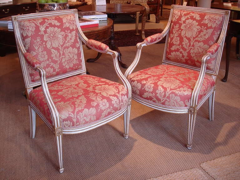 Neoclassical Pair of George III painted and gilt salon chairs