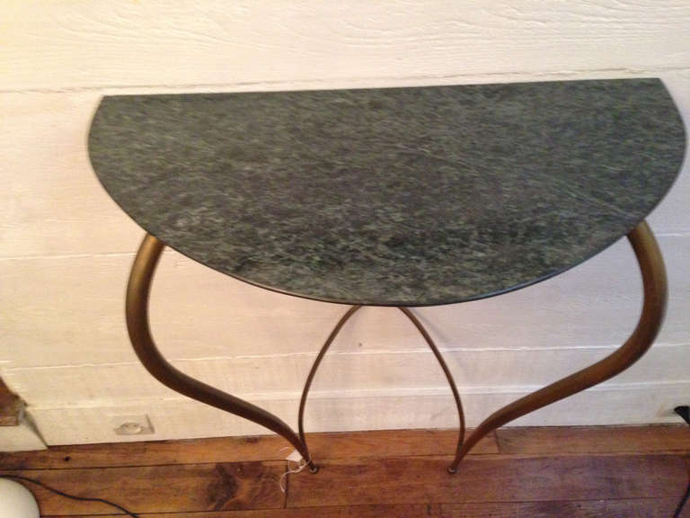 Console in the style of  Guglielmo Ulrich, brass, and marble top.