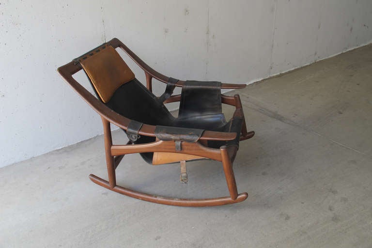 Rare rocking chair, designer Arne Ruud Tidemand, 1959, wood and leather, has a broken buckle on the leather, the state of conservation and good.