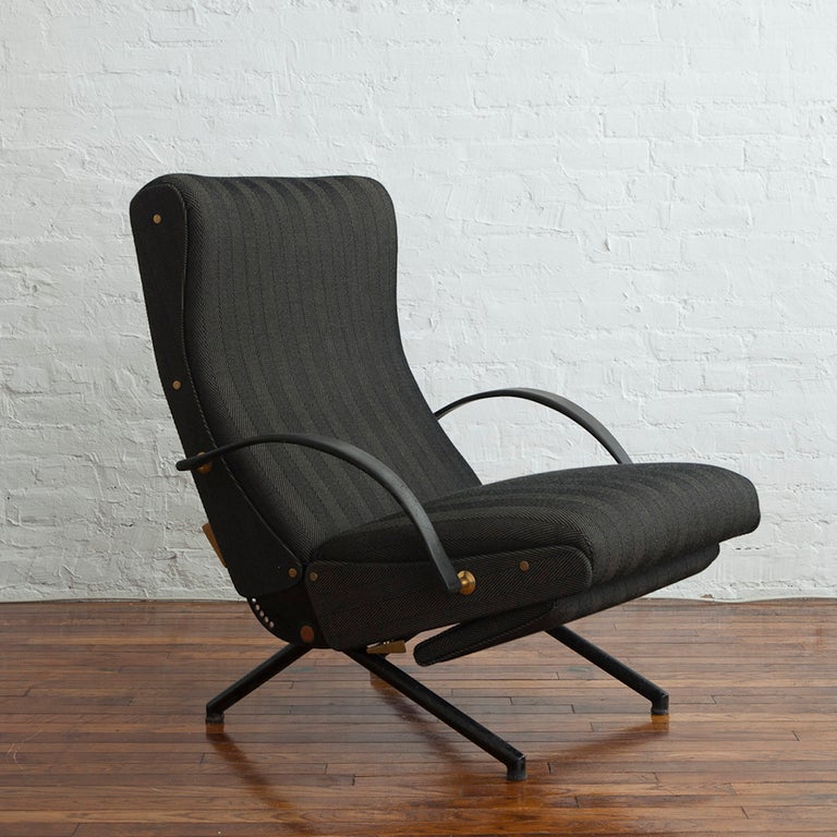 Rare early P40 adjustable lounge chair by Osvaldo Borsani, with single-piece back, two-point screws and non-demountable base. Manufactured by Tecno S.p.A., Milan, with applied metal manufacturer’s labels to frame. Re-upholstered in Tecno herringbone