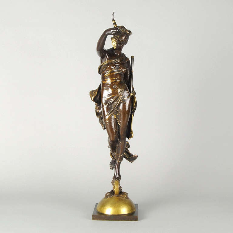 A wonderful bronze study of a beautiful female representing the goddess Fortuna as she holds a cornucopia and a rudder. The bronze with wonderful rich brown patina and parcel gilding that accentuates parts of the sculpture. The figure is further