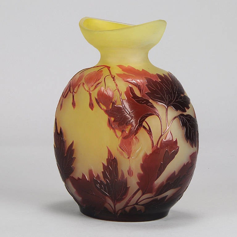 A striking late 19th Century French cameo glass vase of bulbous form, the eye catching variegating red floral hearts design, acid cut and etched against a vibrant yellow field, signed in cameo Galle.
Date: 1890 Condition: Excellent Original