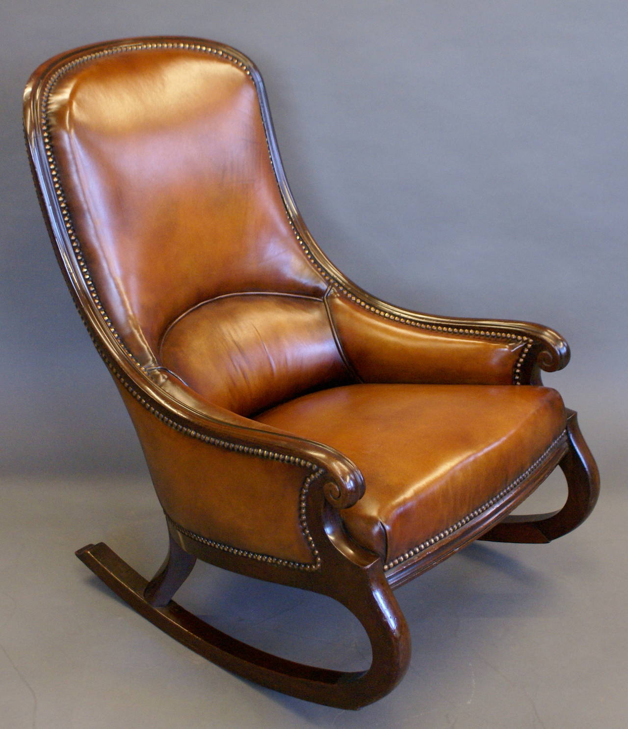In very good and original condition and beautifully upholstered in hand dyed leather.