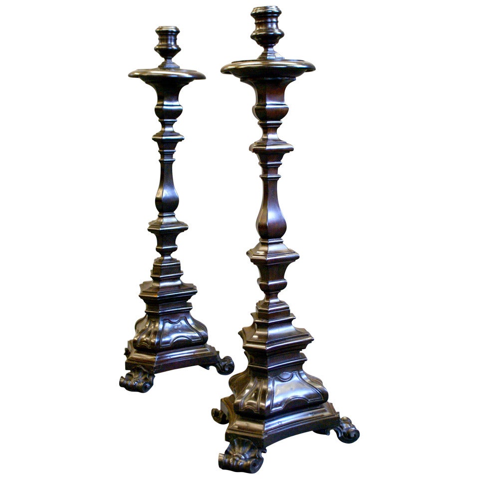 A very rare pair of early 18th century Portuguese solid Ebony candle sticks